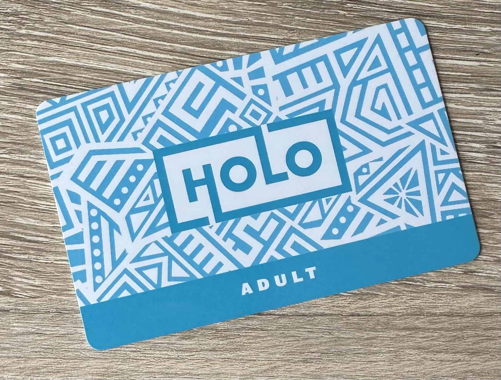 A card with the words "Holo" and "Adult" on it.