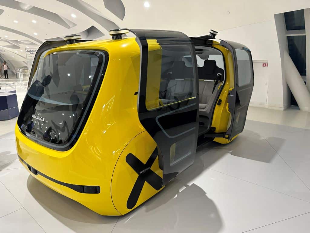 Futuristic yellow bus with open doors at Dubai's Museum of the Future