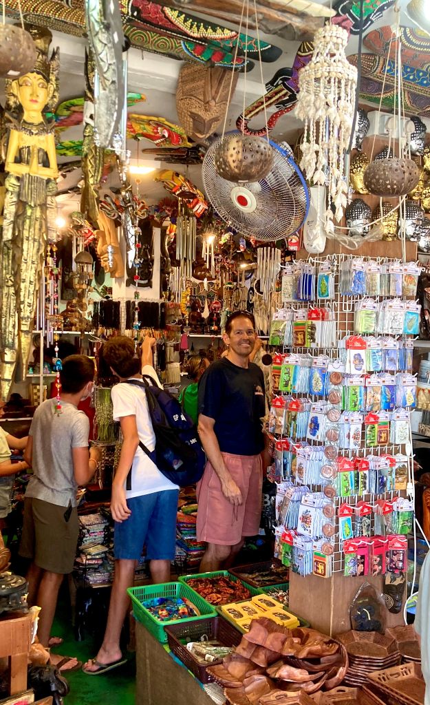 A colorful, cluttered souvenir shop in Sri Lanka, with hundreds of items on every surface of the store.