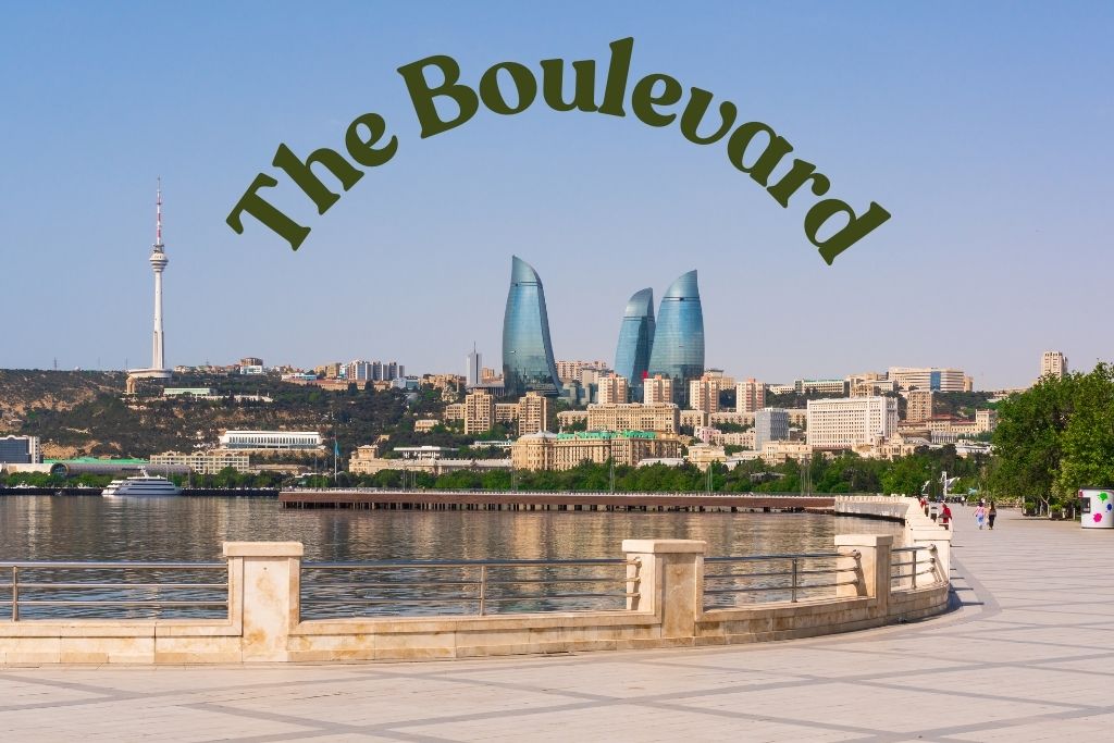 A wide pedestrian walkway along the Caspian Sea in Baku. The words "The Boulevard" are curved at the top of the image.
