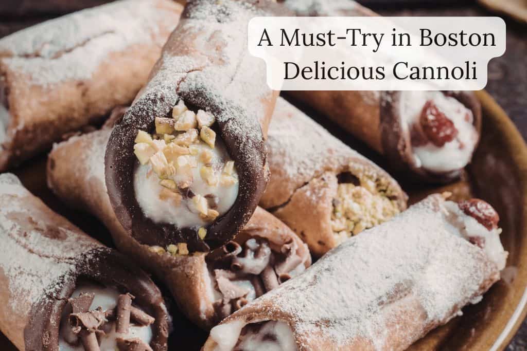 Traditional Italian cannoli filled with sweet ricotta cream and dusted with powdered sugar, shown with the text “A Must-Try in Boston: Delicious Cannoli” overlaid on the image.