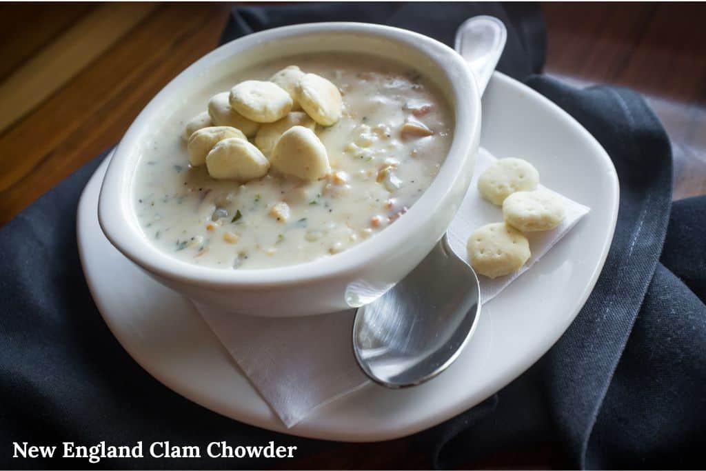 Bowl of creamy New England clam chowder with clams and potatoes, a classic dish to try when deciding what to eat in Boston.