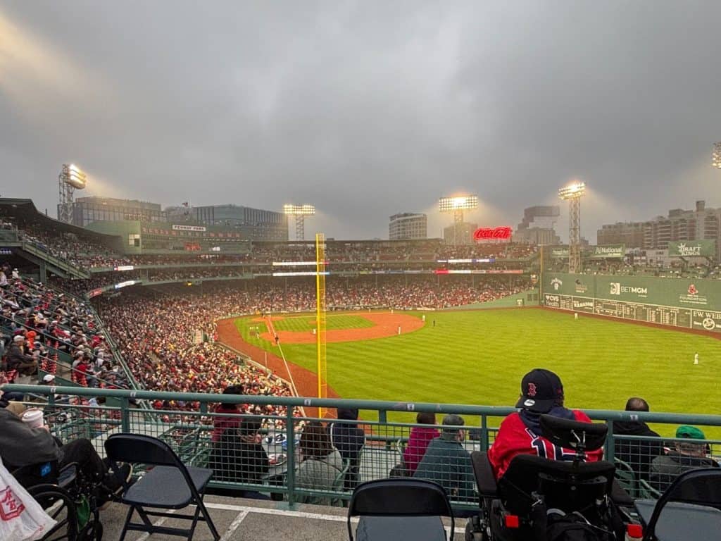 Crowd at a Boston Red Sox game inside Fenway Park during the baseball season, a popular summer experience and a highlight of the best time to visit Boston.