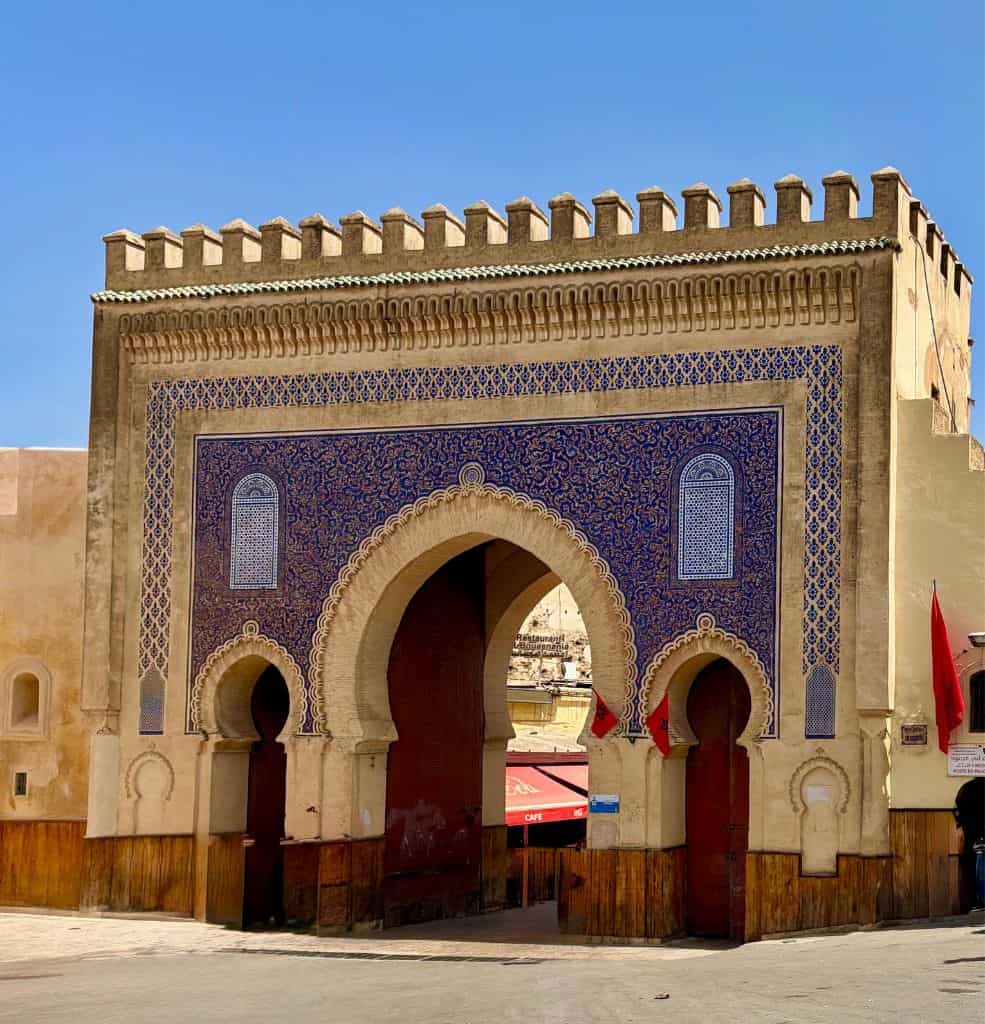 Blue-tiled Bab Bou Jeloud gate at the entrance to the medina in Fes, Morocco.