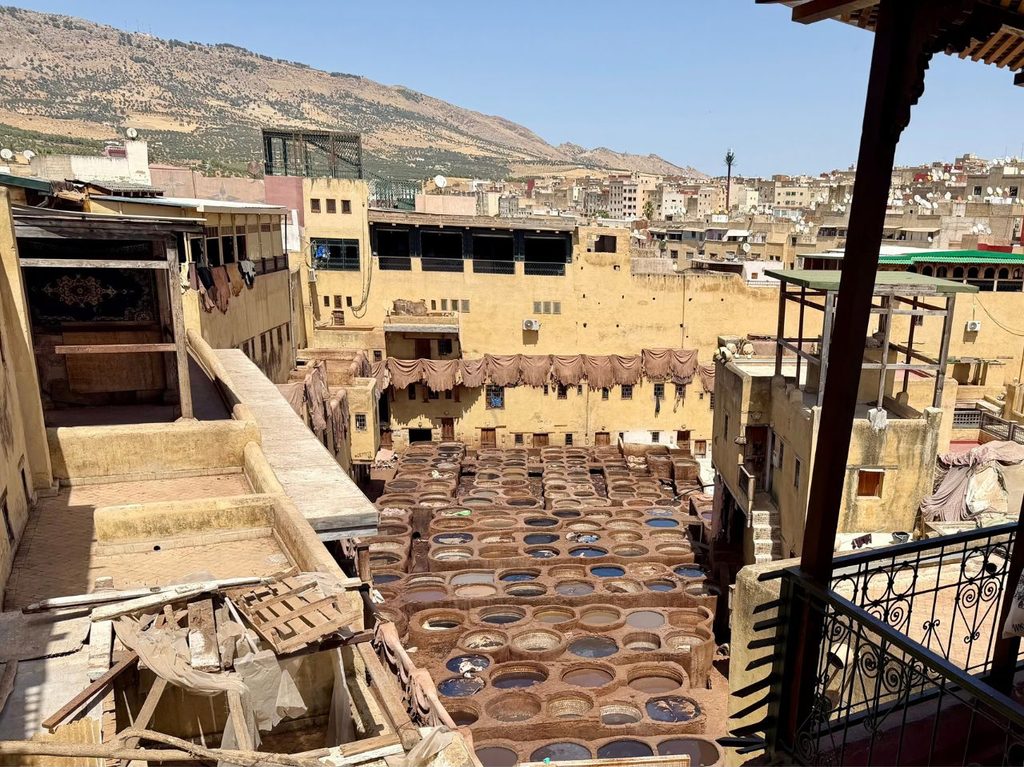View over the dyeing vats at Chouara Tanneries in the Fes medina, Morocco.