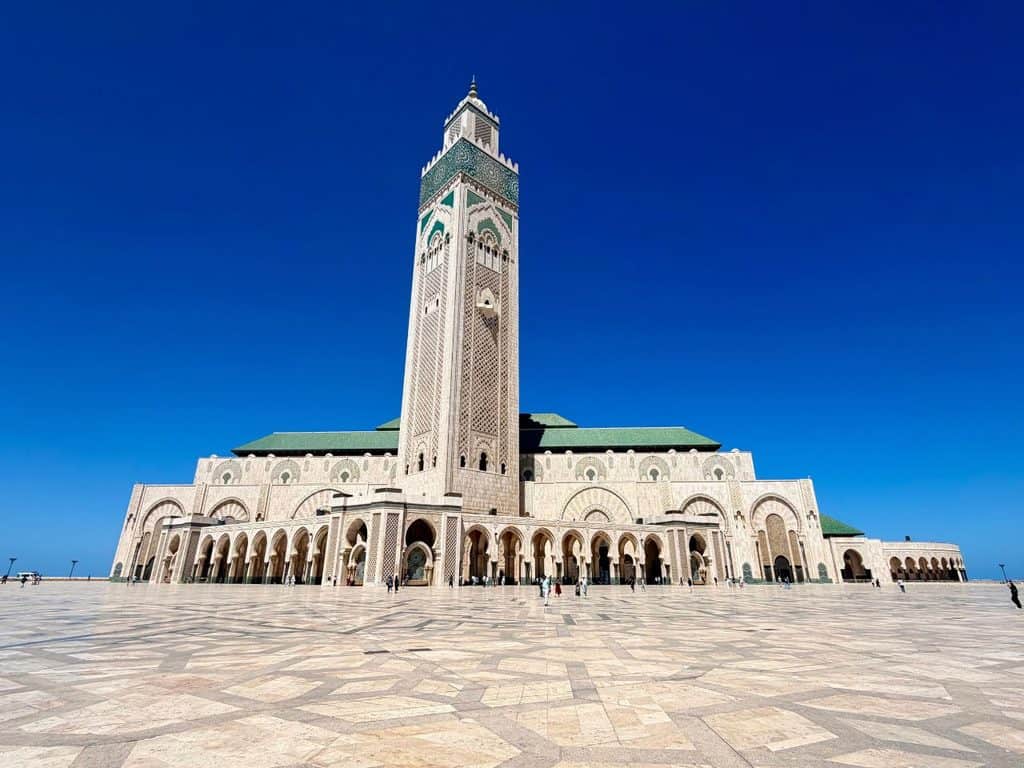 Hassan II Mosque in Casablanca, Morocco, with its tall minaret and large courtyard.