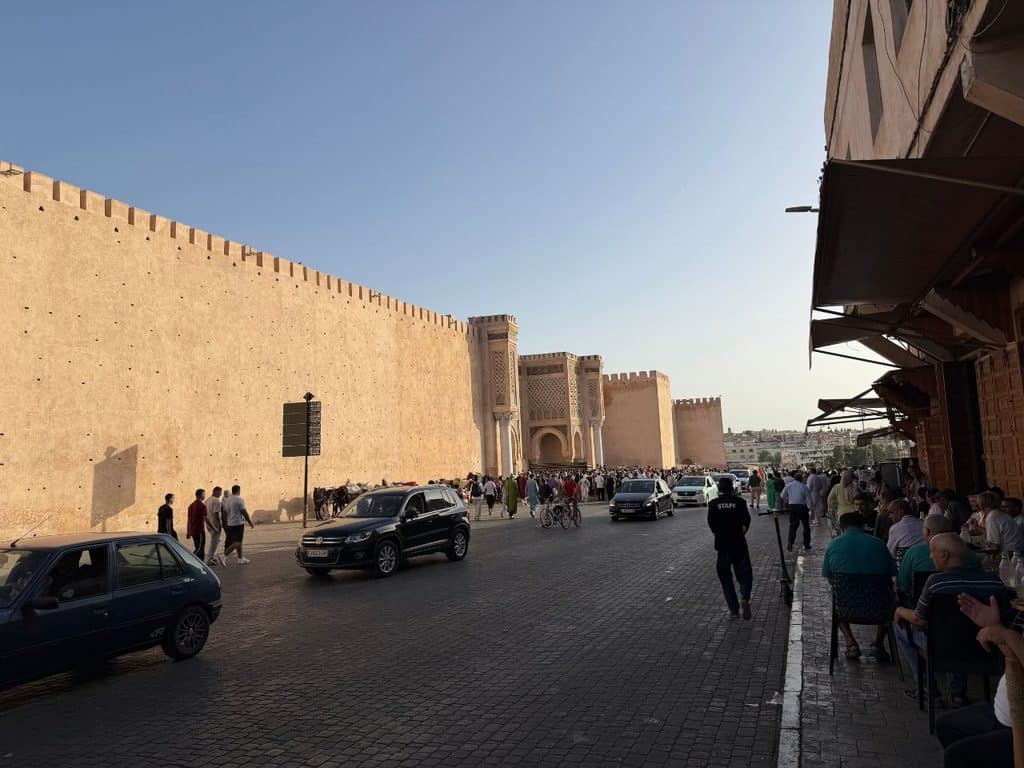 Historic city walls and monumental gate in Meknes, Morocco.