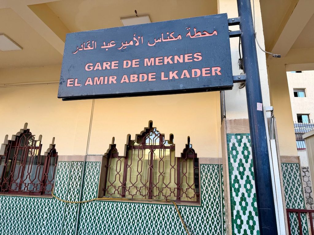 Gare de Meknes El Amir Abdelkader train station sign in Meknes, Morocco.